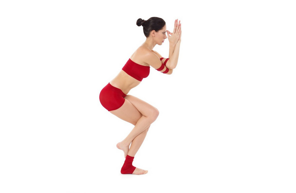 Woman practicing eagle pose