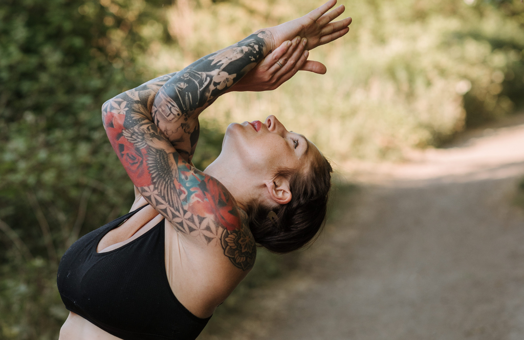 Woman practicing eagle pose outdoors