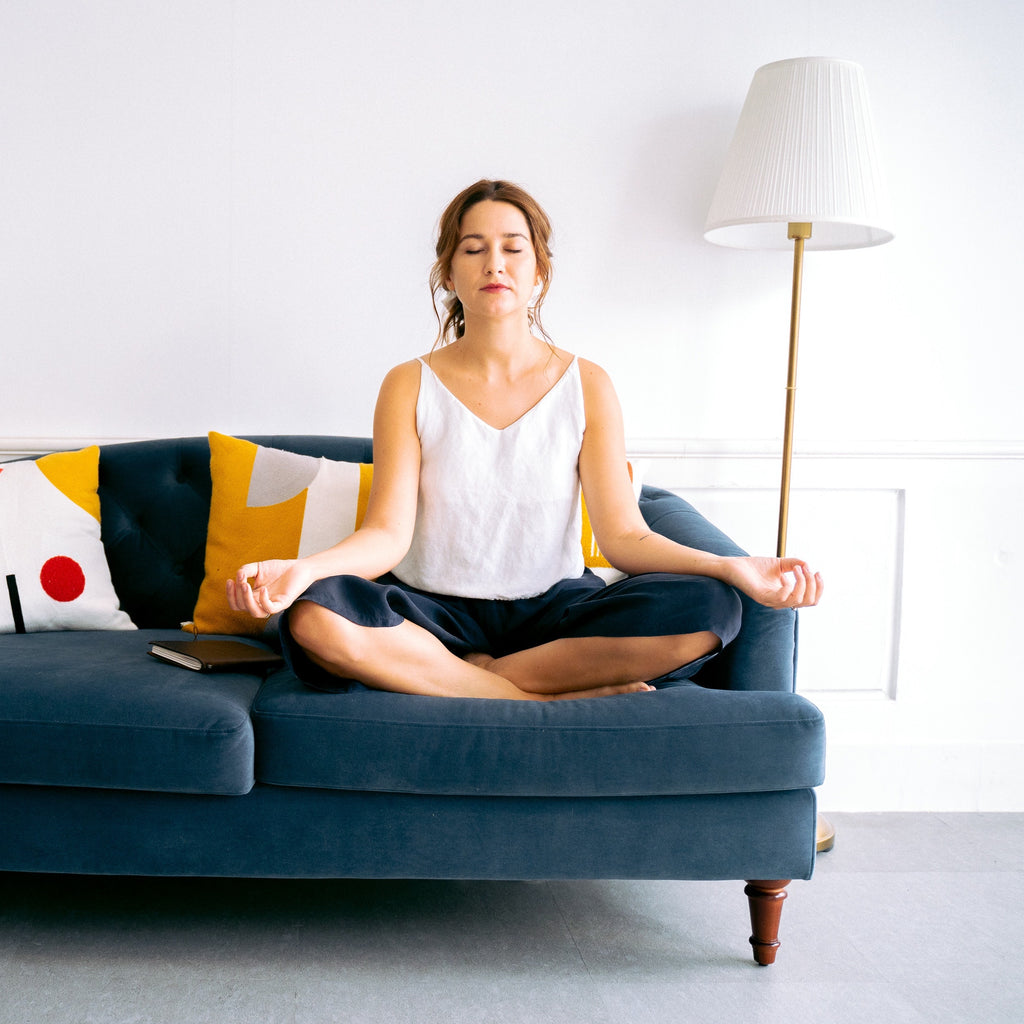 woman practicing chair yoga