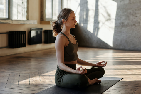 woman meditating and concentrating on her breathing