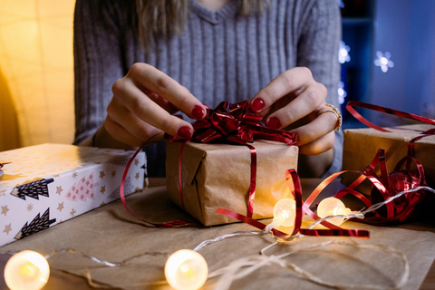  a women wrapping gifts