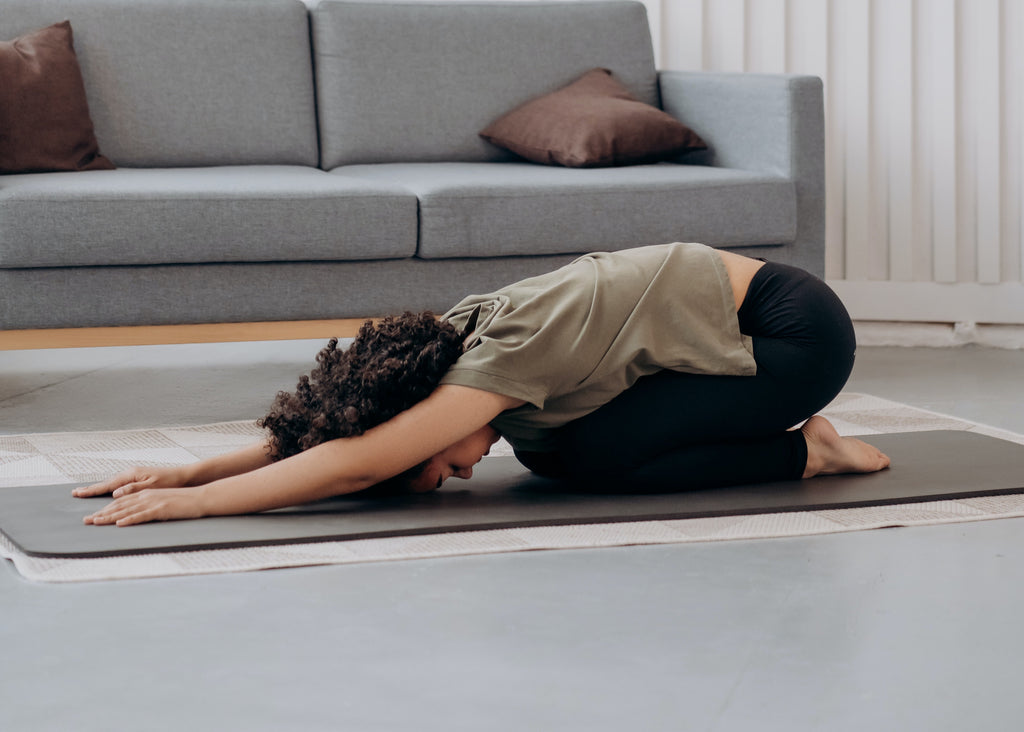 woman in restorative yoga pose