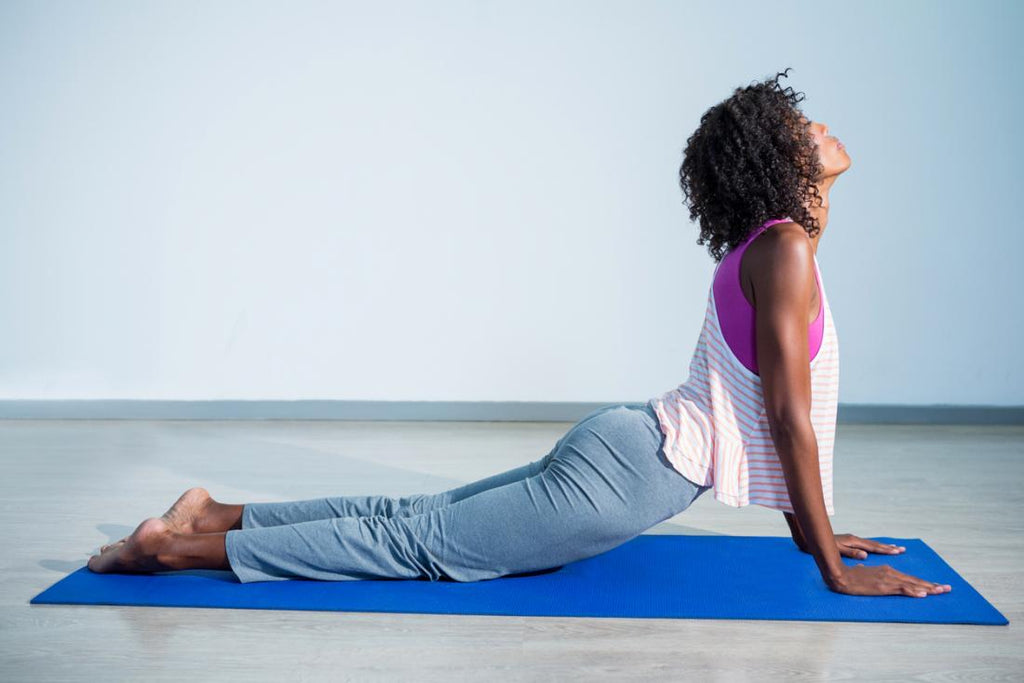 young woman in cobra pose