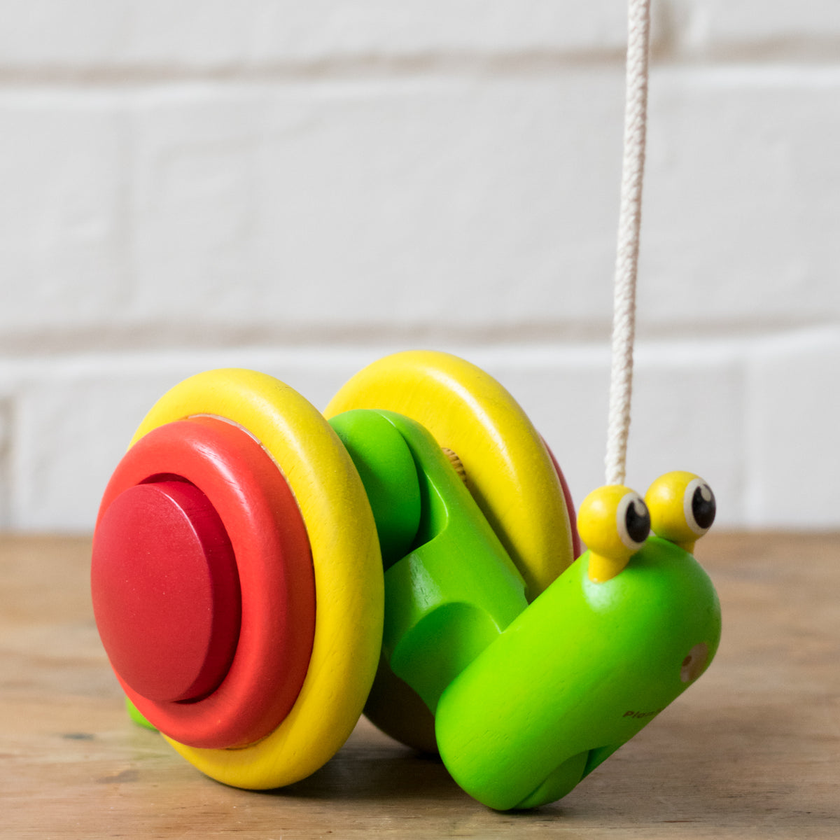 plan toys pull along snail