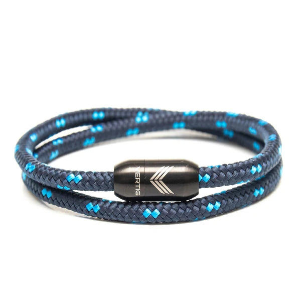 Product image 1 of Vertig dark blue magnetic nautical paracord bracelet with metal clasp, coiled neatly on white background.