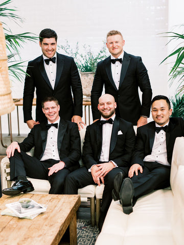 Groom and groomsmen pose together before the ceremony.