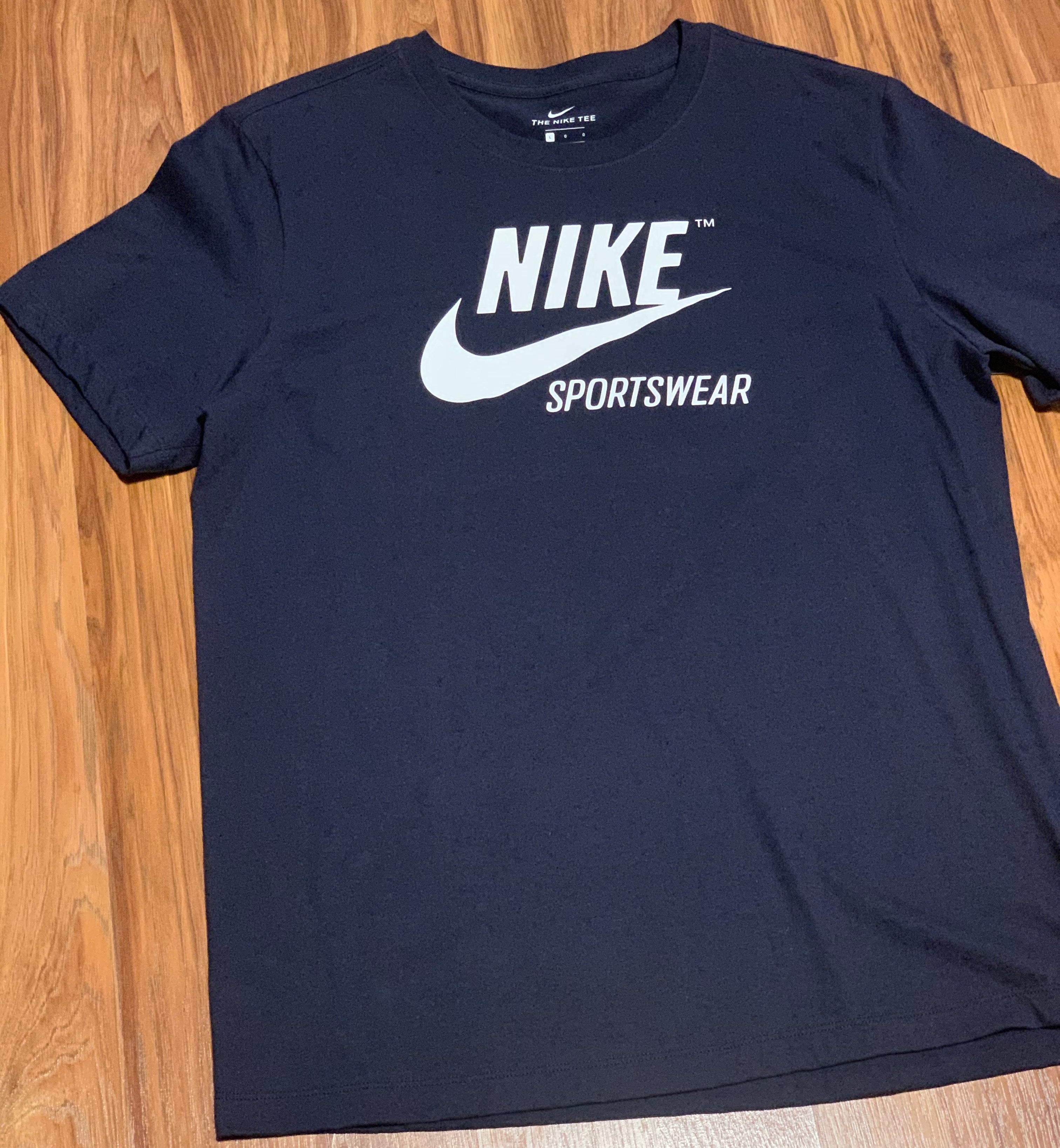 white and navy nike shirt