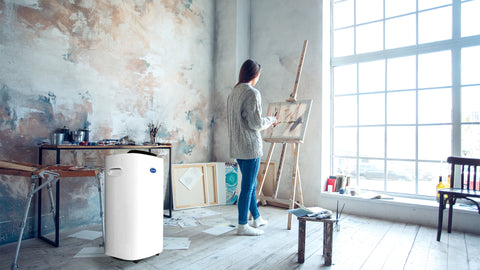 lady-doing-her-artwork-with-carrier-dehumidifier-concepstore-january-2024-blog