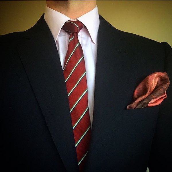 Black suit red tie