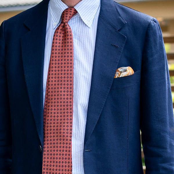 Navy jacket bright tie