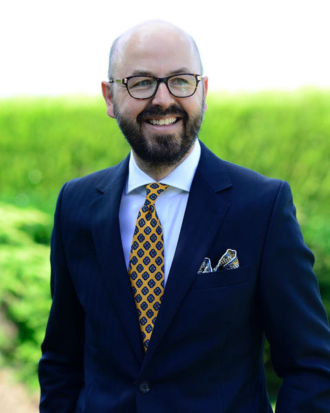 Navy jacket yellow tie