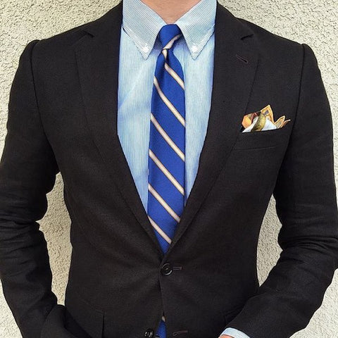 black suit blue striped shirt