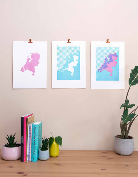 Triptych of two layers of Letterpress art print showing map of the Netherlands and the area below sea level. Magenta plus cyan plus final print. White background.
