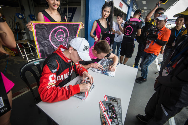 Oloi/BlackArts Racing drivers sign autographs for fans