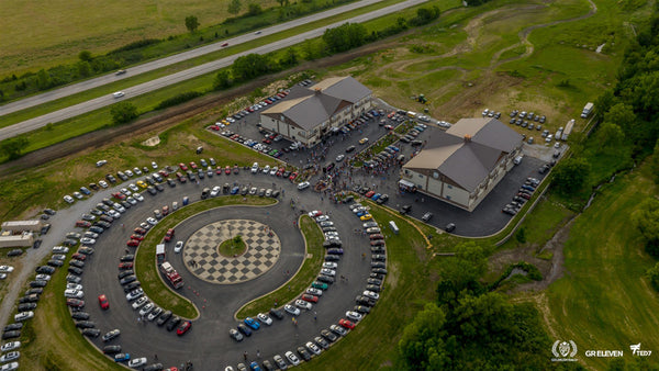 Aerial view of a parking lot with goldRush Rally cars