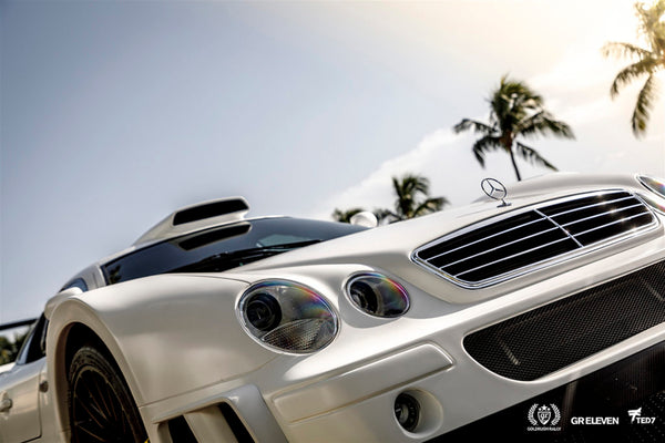 View of the front bumper of a white Mercedes