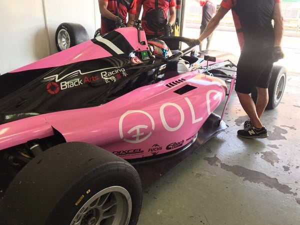 F3 Driver Charles Leong prepares for the next race from within the cockpit of the pink Oloi F3 car.