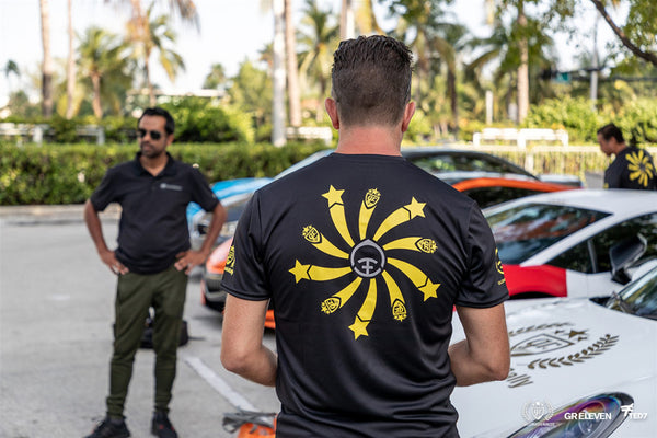 A man wearing Oloi/goldRush Rally shirt