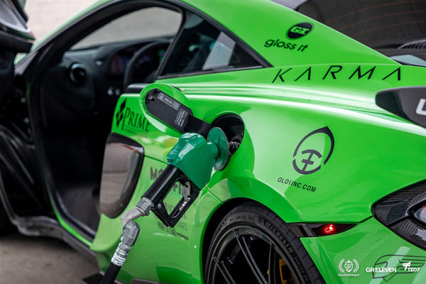 A green car with gas pump featuring the Oloi logo