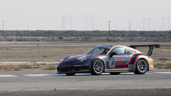 Oloi's Porsche 911 Cup car on the track at Buttonwillow Raceway