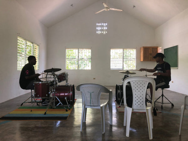 Two World Without Walls students play drums