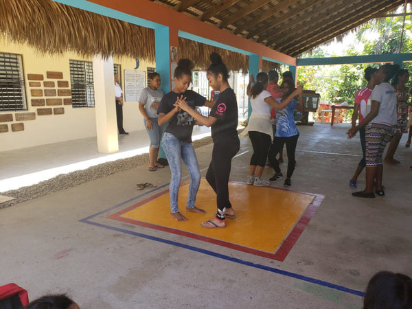 A World Without Walls student practices her dancing in the Dominican Republic