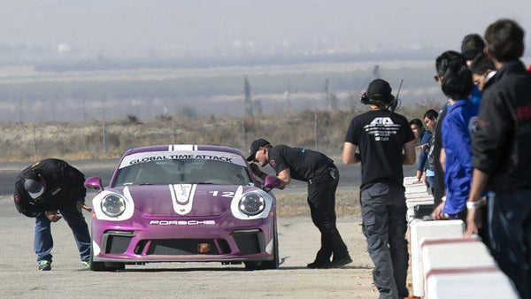 Technicians check in with driver during a heat at Global Time Attack 2018