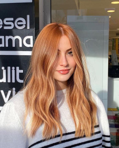 Gorgeous lady with sunset coral peach balayage