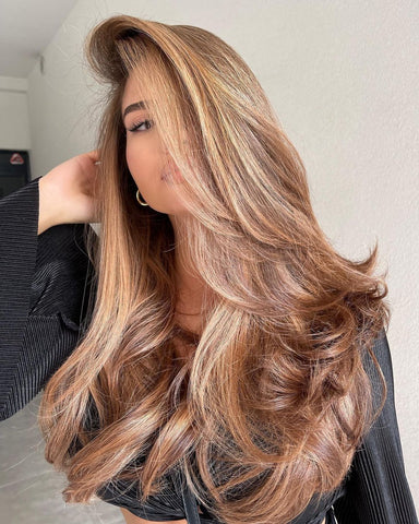 Gorgeous lady with vanilla highlights hair color