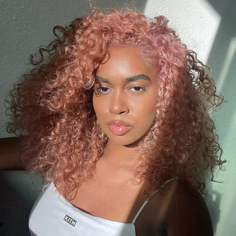 Woman with curly rose gold spring hair