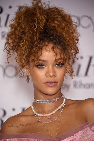 Rihanna in a high ponytail, caramel brown spring hair color