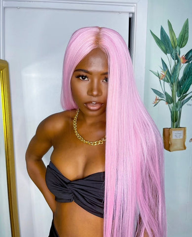 Gorgeous lady wearing a sleek pink straight wig