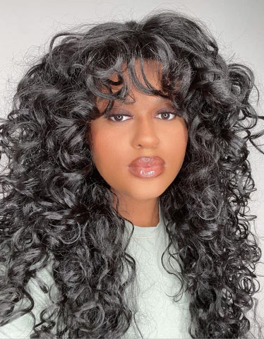 Beautiful Gemini woman wearing a curly wig