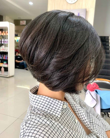 brown layered slanted bob hairstyle