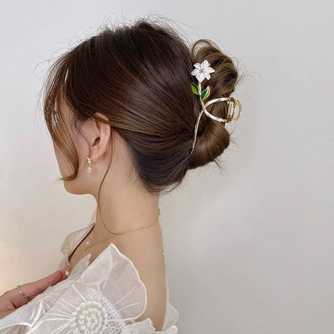 Woman wearing flower hair claw clip