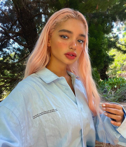 Instagram model girl with pastel pink spring hair color