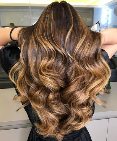 Beautiful warm brown balayage in a long hair