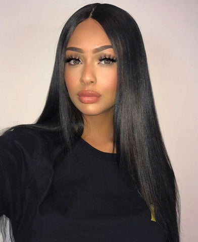 Beautiful woman wearing a sleek, black, straight wig