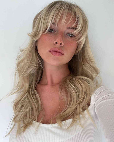 woman wearing blond fringe wig
