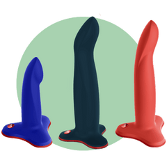 Limba flex dildo in all sizes on a green background