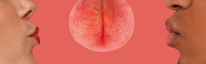 A close up of a peach that looks like a butt with a person mouth standing close to it on each side