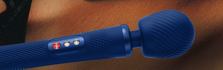 Blue Vim Vibrating Wand by Fun Factory with the skin of a woman in the background