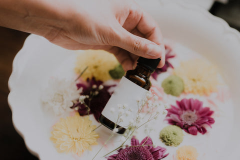 eucalyptus essential oil on bed of flowers