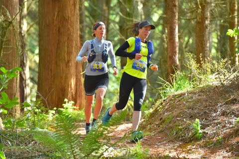 Emma McCosh overtaking in the forest