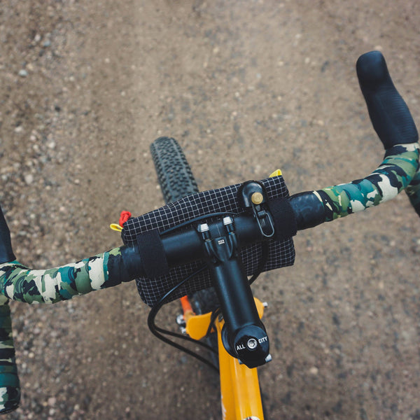 topo designs bike bag for handlebars with shoulder strap in yellow