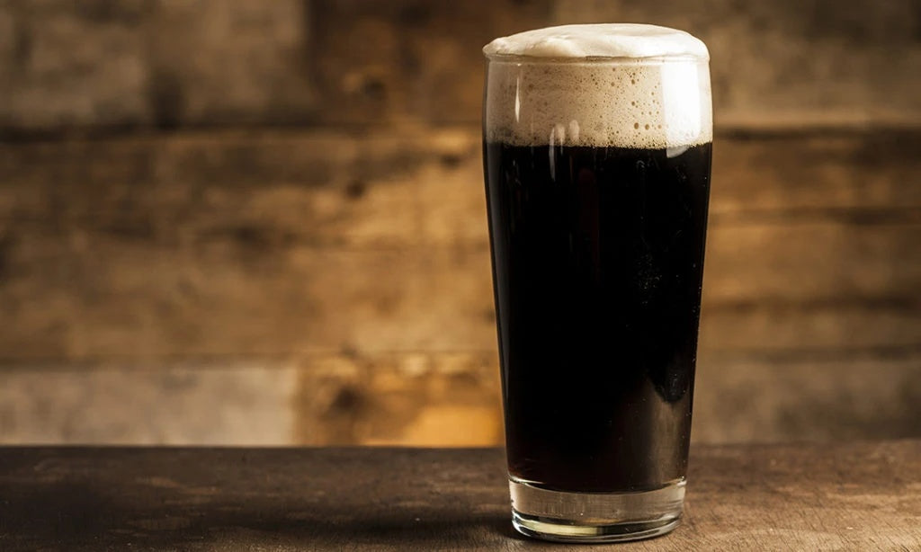 A glass of dark coloured German Schwarzbier beer