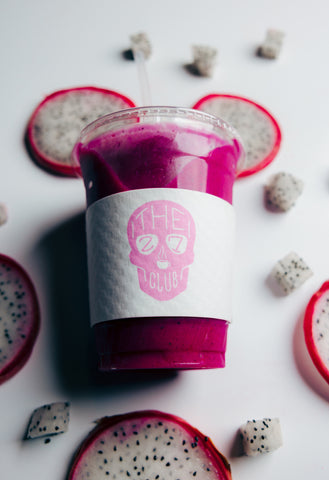 Hot Pink Smoothie surrounded by dragon fruit sliced