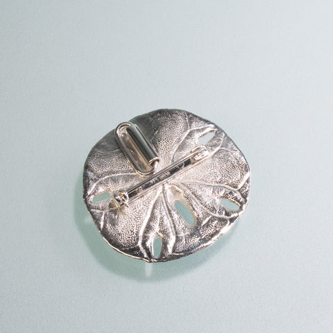 back of sand dollar pendant and brooch by hkm jewelry