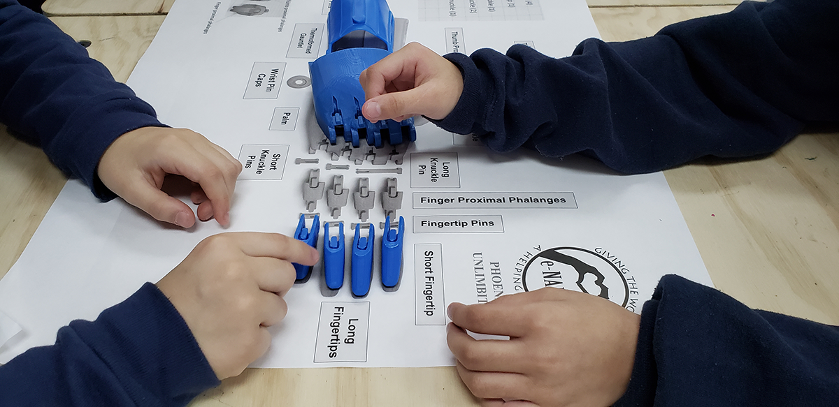 Peck Elementary School Students build a 3D printed e-NABLE hand prosthetic for a recipient during a workshop to learn about how 3D printing can be used to make a difference.