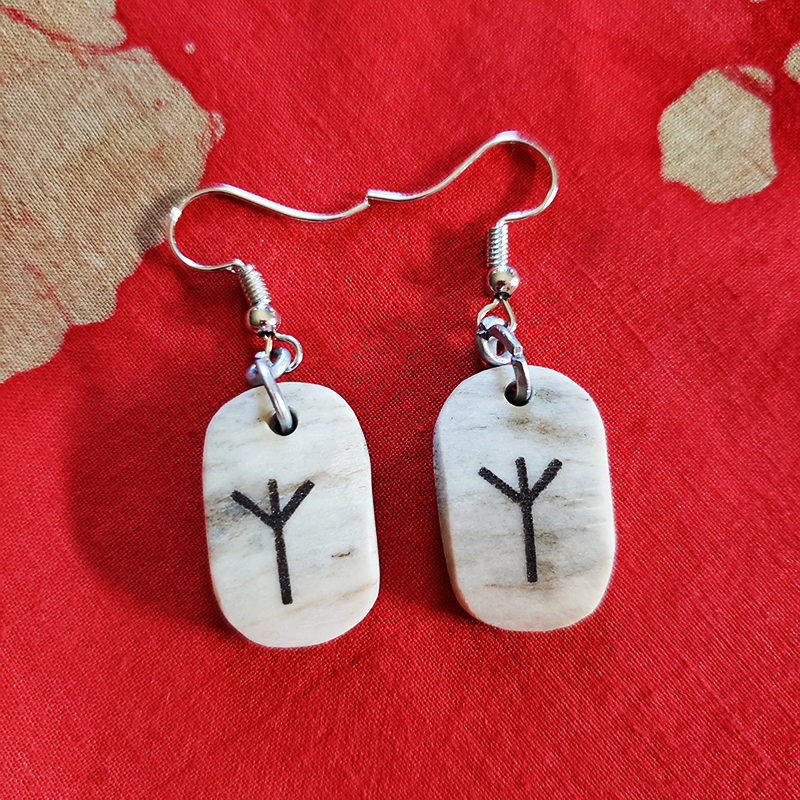 Earrings with laser etched runes on bone